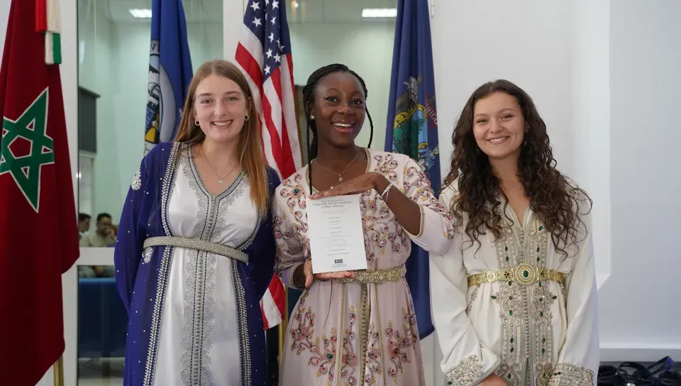 Three female students pose for a photo at the Tangier, Morocco campus